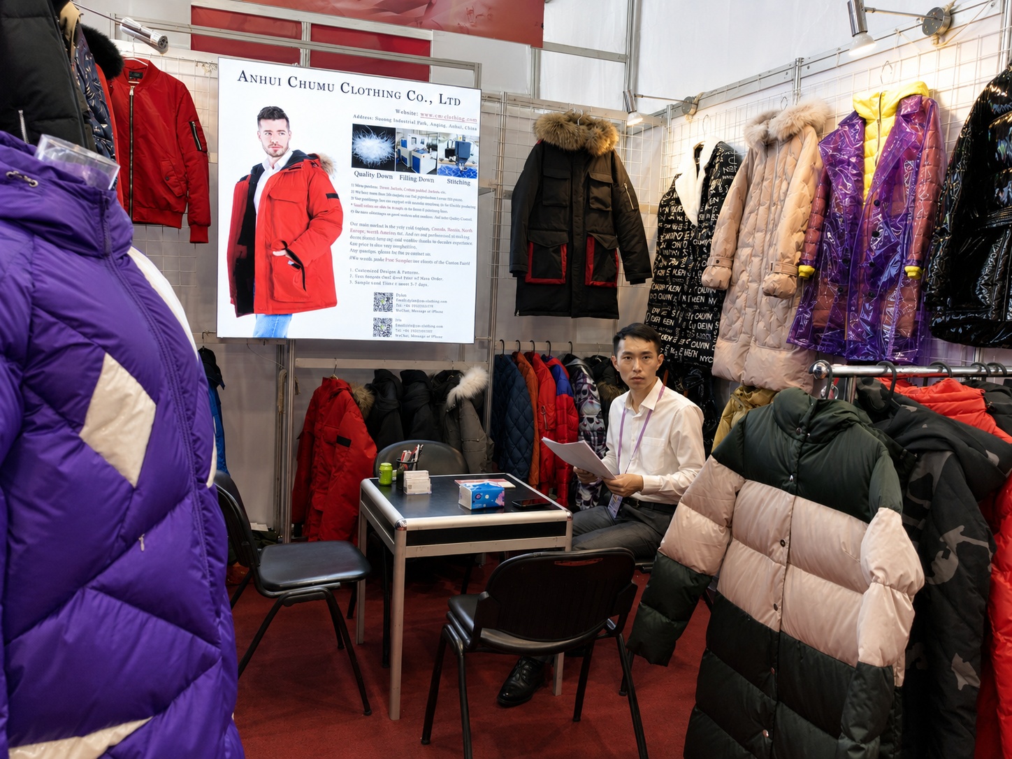 Mobility apparel team at Canton Fair booth with winter jackets